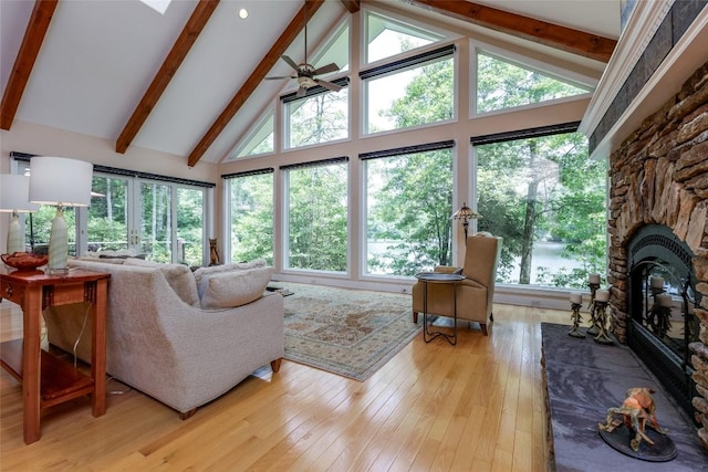 135 Whisper Lake Dr, Sapphire, NC 28774 - living room with beamed ceiling, light wood-type flooring, high vaulted ceiling, a water view, and plenty of natural light