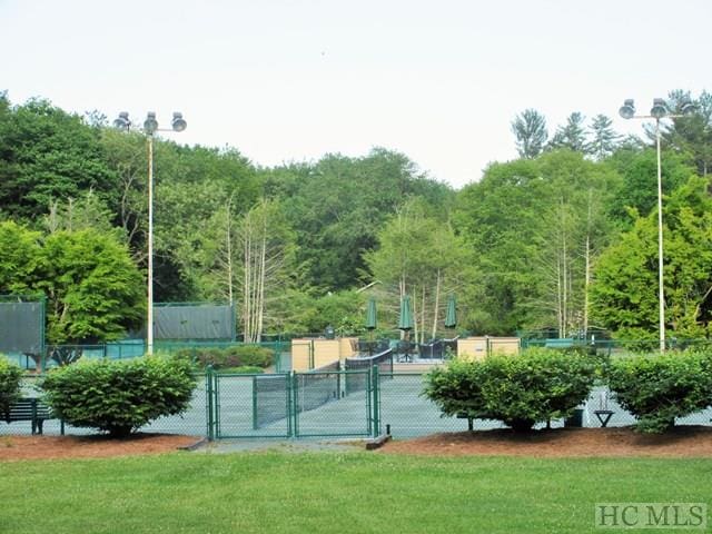 135 Whisper Lake Dr, Sapphire, NC 28774 - surrounding community featuring a gate and a wooded view
