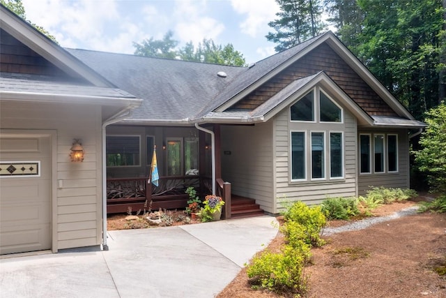 135 Whisper Lake Dr, Sapphire, NC 28774 - view of front of property featuring a garage, driveway, and roof with shingles