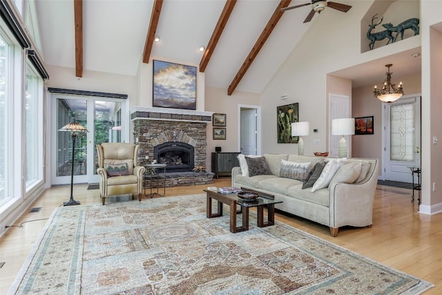 135 Whisper Lake Dr, Sapphire, NC 28774 - living room with high vaulted ceiling, wood finished floors, a chandelier, beam ceiling, and ceiling fan