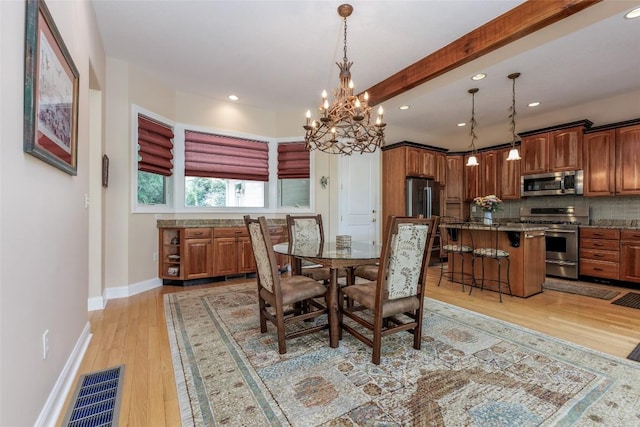135 Whisper Lake Dr, Sapphire, NC 28774 - dining space featuring light wood finished floors, a chandelier, and recessed lighting