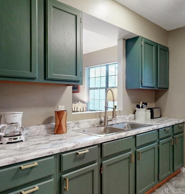 kitchen with sink and green cabinets