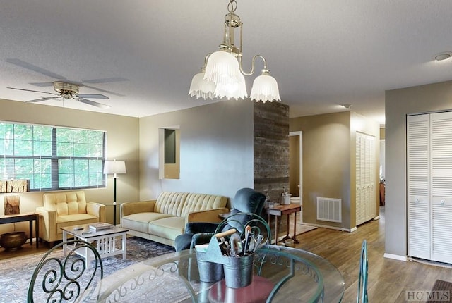 living room with hardwood / wood-style floors and ceiling fan