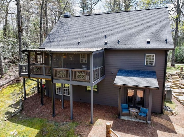 49 Lakeside Fls, Cullowhee, NC 28723 - rear view of house featuring a sunroom and a shingled roof