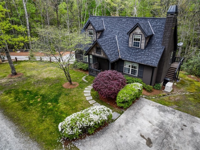 49 Lakeside Fls, Cullowhee, NC 28723 - view of front of home featuring a chimney, a view of trees, stairs, roof with shingles, and a front lawn