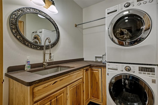 49 Lakeside Fls, Cullowhee, NC 28723 - laundry room with a sink, stacked washing maching and dryer, and cabinet space