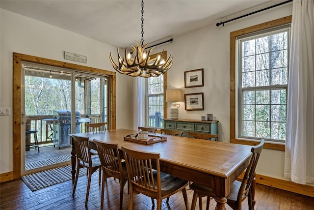 49 Lakeside Fls, Cullowhee, NC 28723 - dining area featuring plenty of natural light, hardwood / wood-style flooring, baseboards, and a notable chandelier