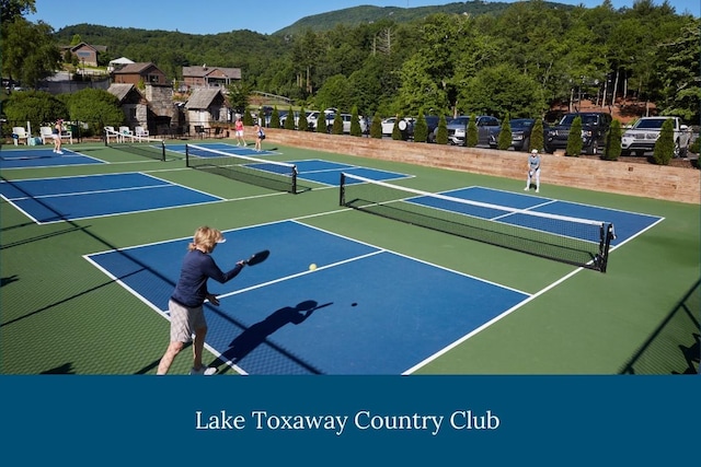 399 Toxaway Ct, Lake Toxaway, NC 28747 - view of tennis court with community basketball court and a wooded view