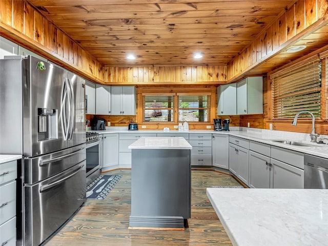 399 Toxaway Ct, Lake Toxaway, NC 28747 - kitchen with stainless steel appliances, wood ceiling, a sink, dark wood-type flooring, and light countertops