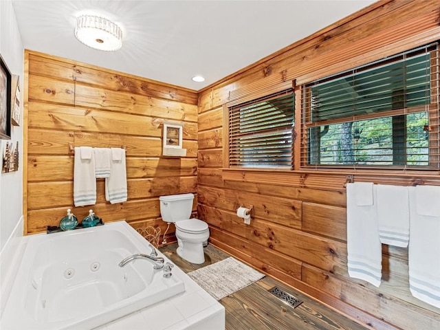 399 Toxaway Ct, Lake Toxaway, NC 28747 - bathroom featuring toilet, a jetted tub, and wooden walls