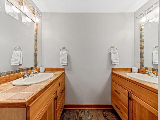 399 Toxaway Ct, Lake Toxaway, NC 28747 - bathroom with two vanities, wood finished floors, and baseboards