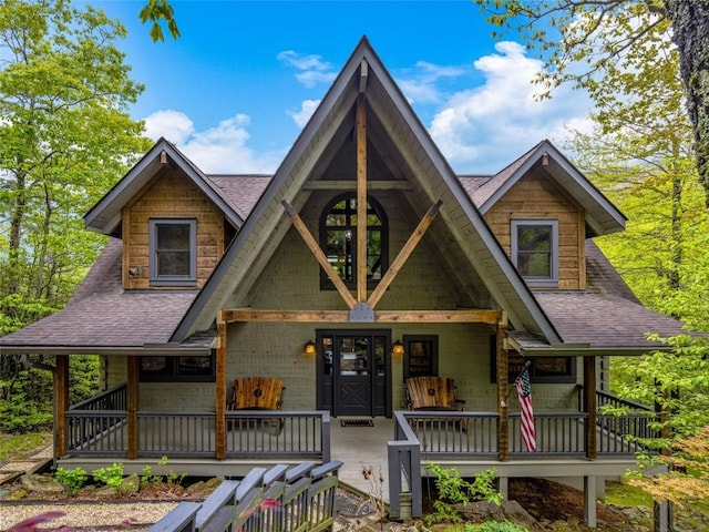 399 Toxaway Ct, Lake Toxaway, NC 28747 - view of front of house featuring a porch and roof with shingles