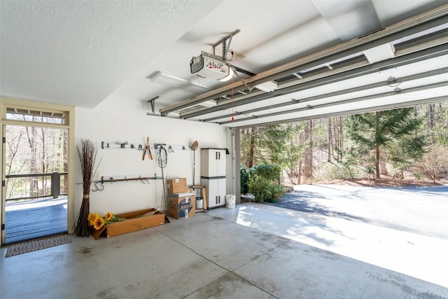 garage featuring a garage door opener