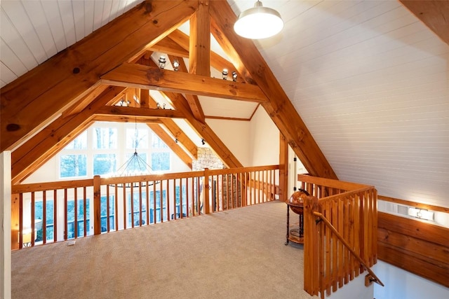 bonus room featuring vaulted ceiling with beams and carpet floors