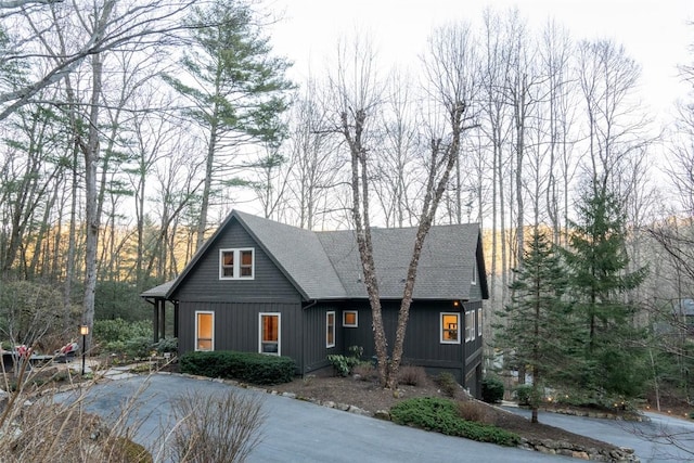 view of front of property with board and batten siding and roof with shingles