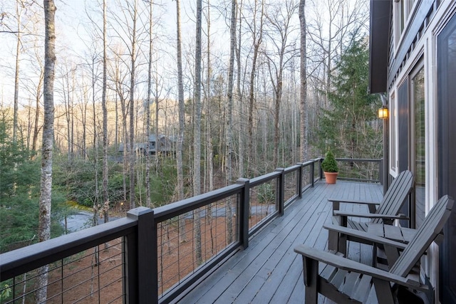 deck featuring a forest view