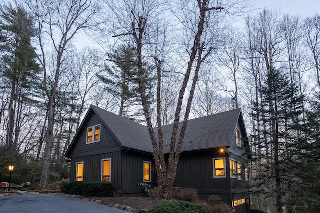 view of front of house featuring board and batten siding and a shingled roof