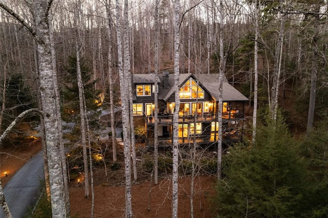 rear view of house with a forest view