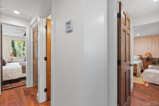 hallway with dark wood-type flooring