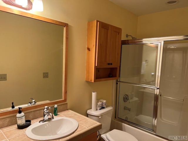 35-B Portland Rdg Unit B, Cashiers, NC 28717 - bathroom featuring bath / shower combo with glass door, vanity, and toilet