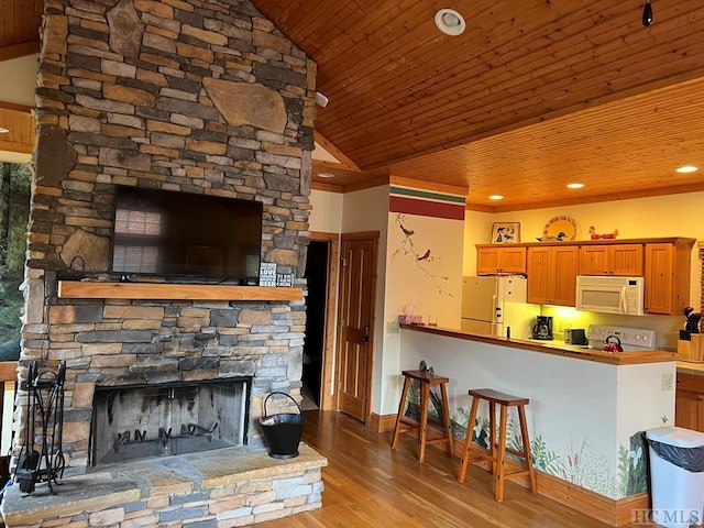 35-B Portland Rdg Unit B, Cashiers, NC 28717 - kitchen with white appliances, wood ceiling, lofted ceiling, wood finished floors, and a stone fireplace