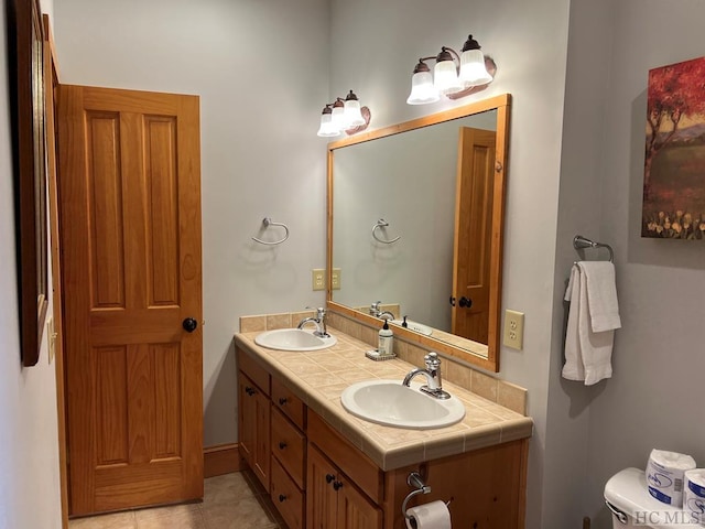 35-B Portland Rdg Unit B, Cashiers, NC 28717 - bathroom with double vanity, toilet, and tile patterned flooring