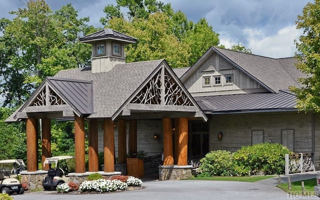 35-B Portland Rdg Unit B, Cashiers, NC 28717 - view of front of home featuring a standing seam roof, a shingled roof, metal roof, and board and batten siding
