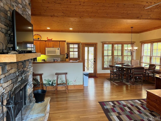 35-B Portland Rdg Unit B, Cashiers, NC 28717 - kitchen featuring white microwave, a fireplace, wooden ceiling, light wood-style flooring, and a chandelier