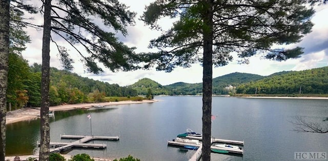 35-B Portland Rdg Unit B, Cashiers, NC 28717 - water view with a heavily wooded area, a floating dock, and mountains
