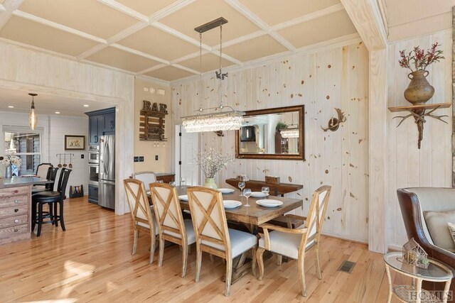 dining space with light wood-type flooring