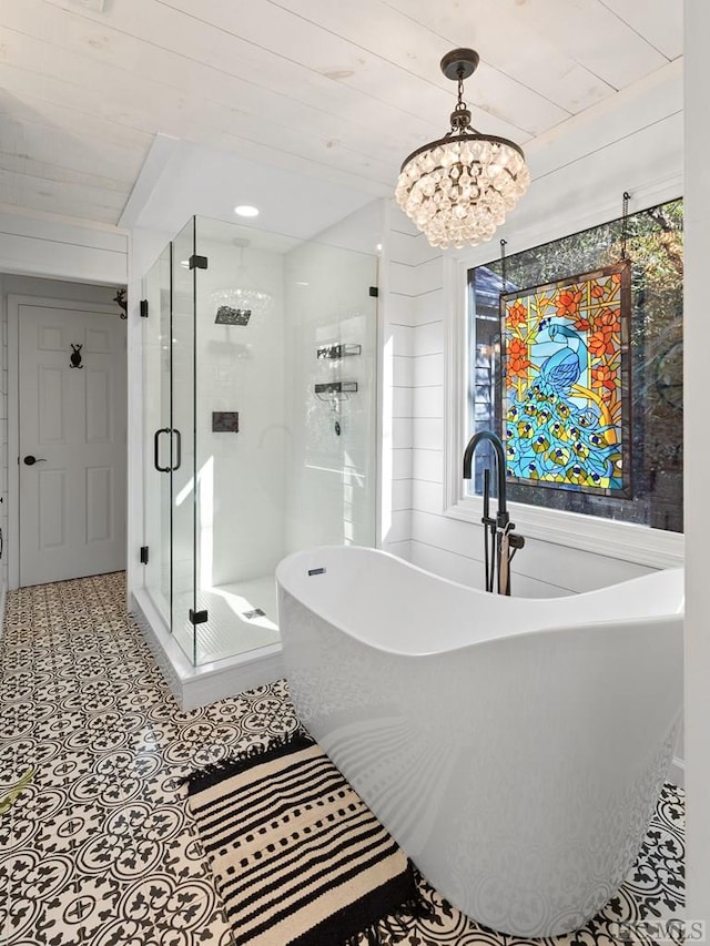 bathroom with an inviting chandelier and plus walk in shower