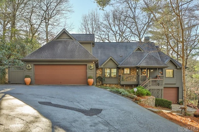 view of front of house featuring a garage and covered porch