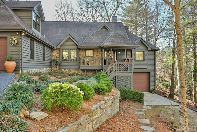 view of front of home with a garage and a porch