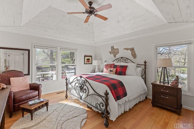 bedroom featuring ceiling fan, lofted ceiling, light hardwood / wood-style floors, and wooden ceiling