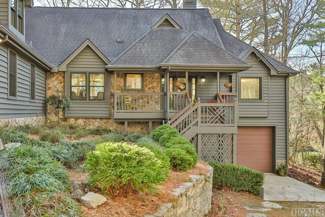 view of front of property featuring a garage and a porch