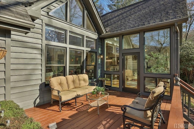 wooden terrace featuring an outdoor hangout area