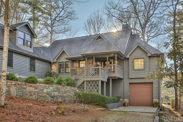 view of front of house featuring a porch and a garage