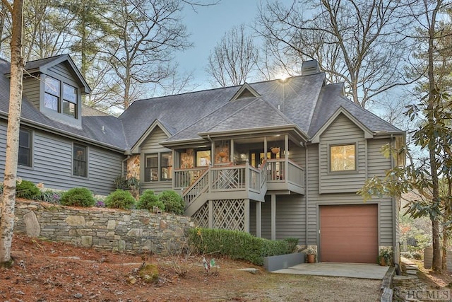 view of front of property with a porch and a garage