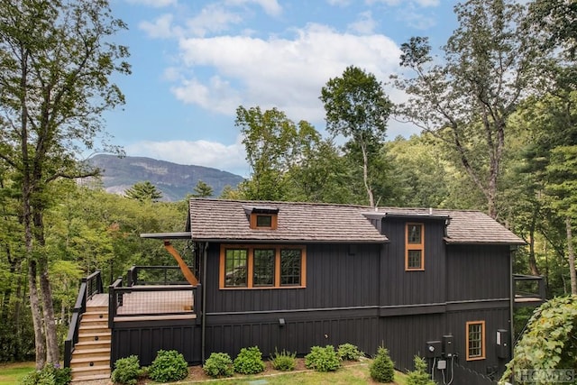 exterior space featuring a deck with mountain view