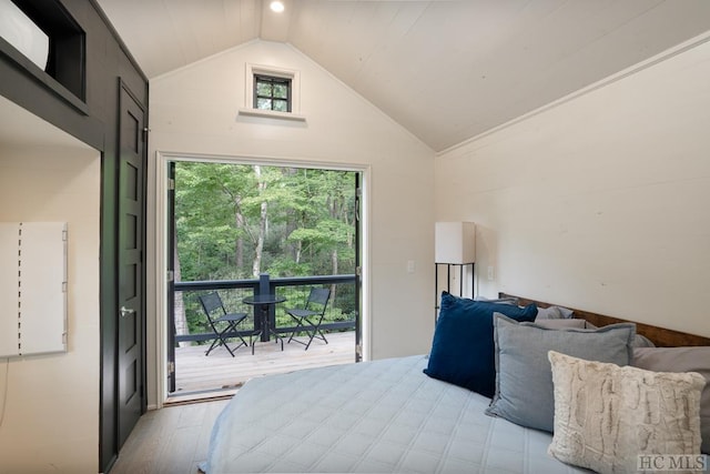 bedroom featuring lofted ceiling and light hardwood / wood-style flooring