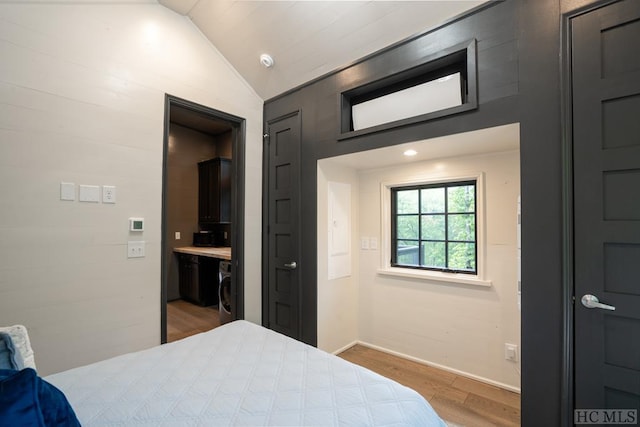 bedroom with wood-type flooring and lofted ceiling