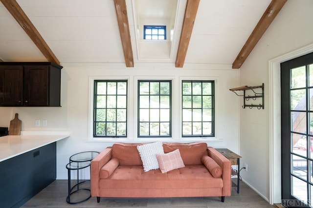 living room with lofted ceiling with beams