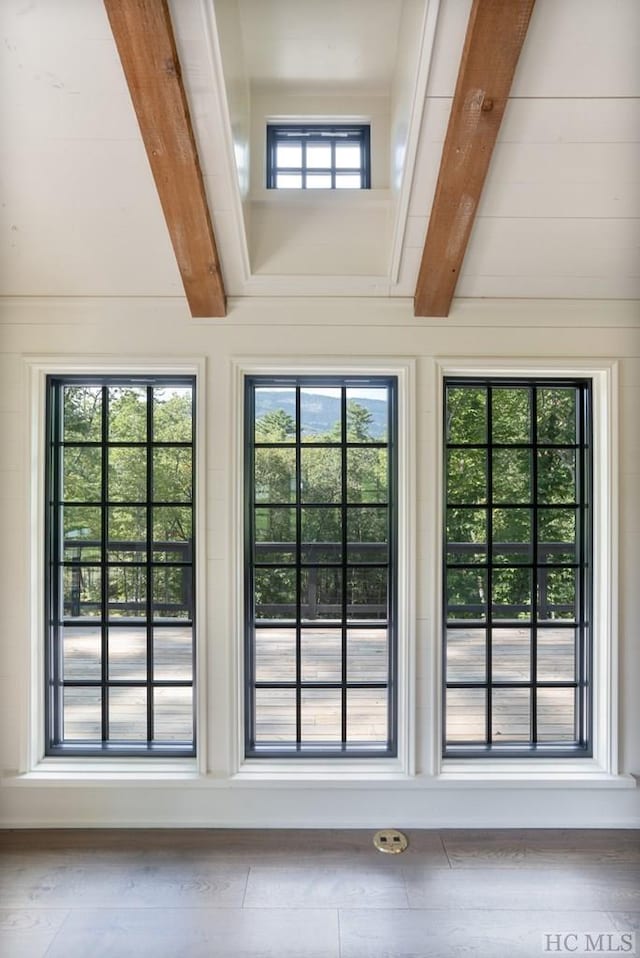 entryway featuring beam ceiling