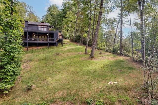 view of yard with a deck