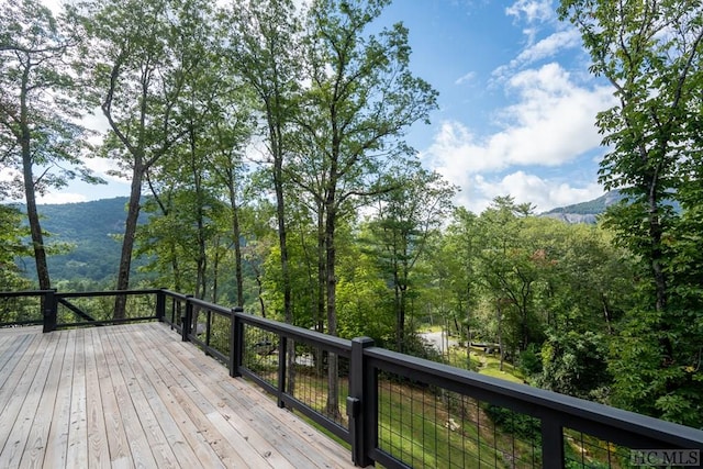 wooden deck with a mountain view