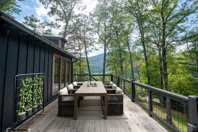 wooden terrace featuring a mountain view