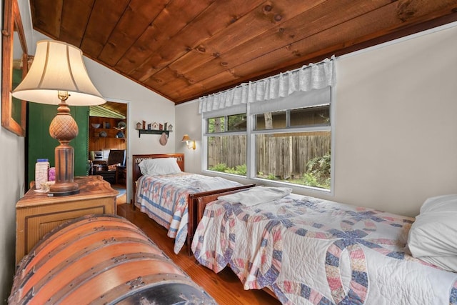 bedroom featuring wood ceiling, lofted ceiling, and wood finished floors