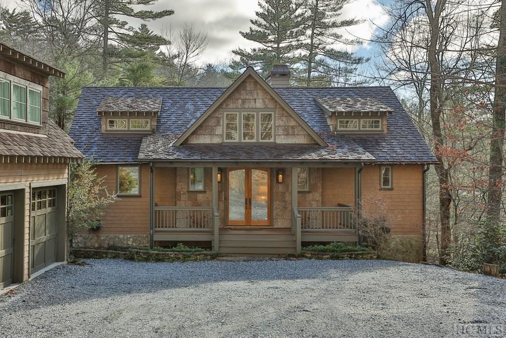 view of front of property featuring a garage and covered porch