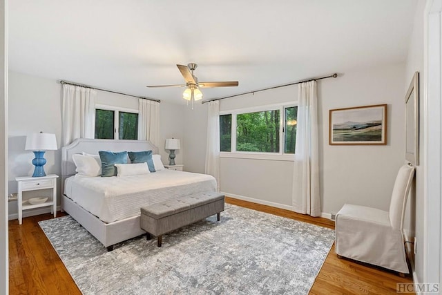 bedroom with hardwood / wood-style floors and ceiling fan