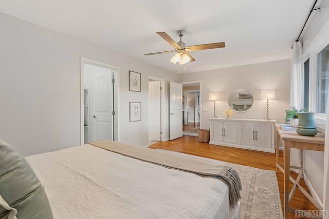 bedroom featuring ceiling fan and light hardwood / wood-style floors